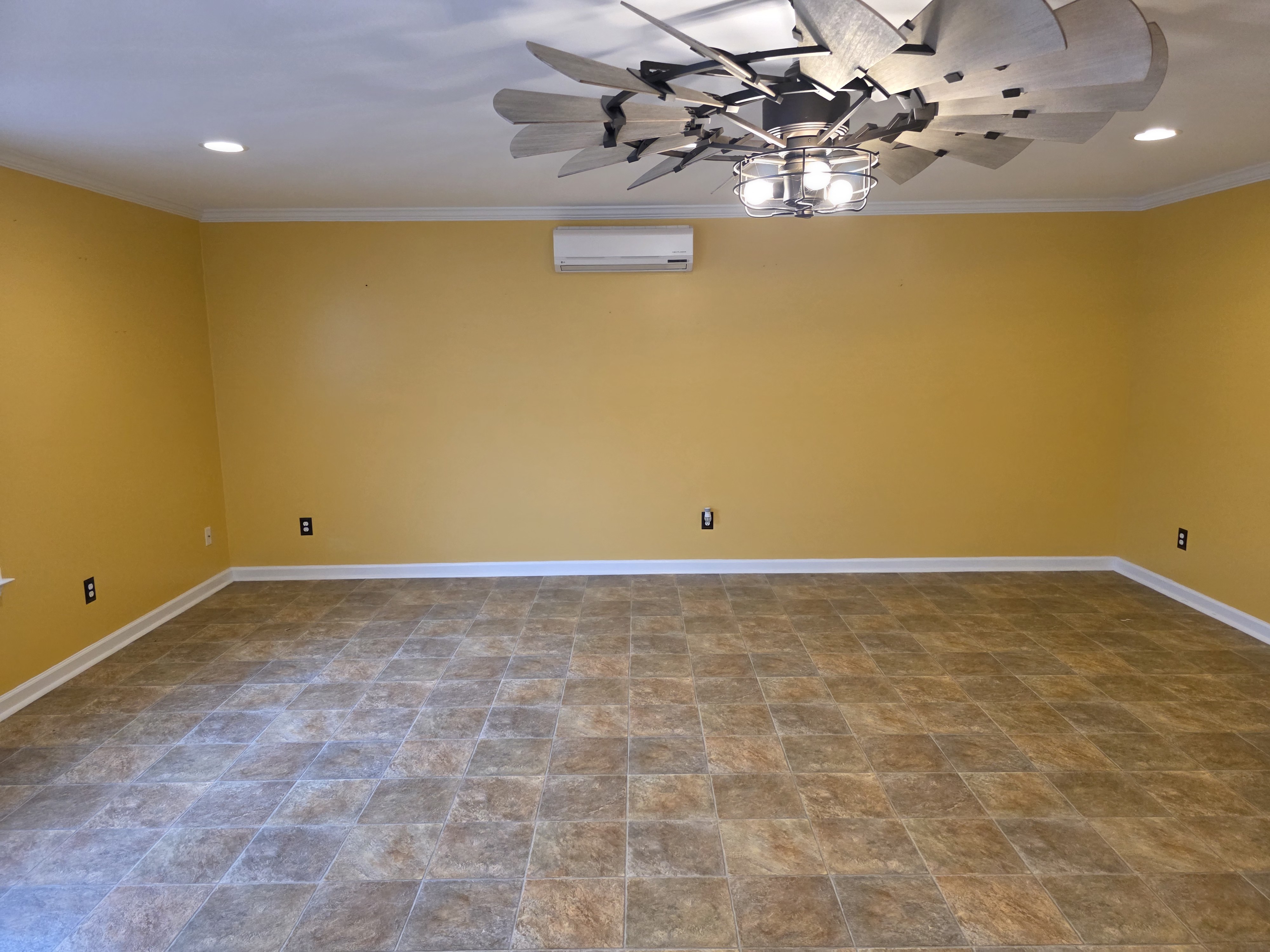 Wide view of the room with existing tile floor before epoxy install